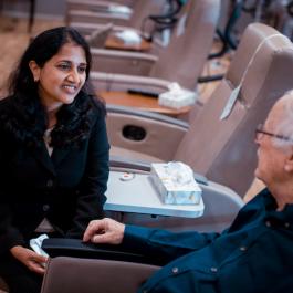 Dr. Midathada with patient in the infusion room
